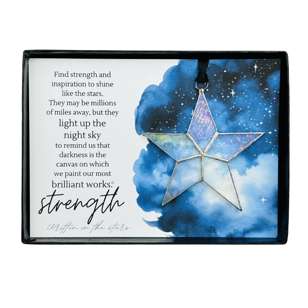Handmade 4" clear iridescent stained glass star with silver edging, packaged with "Strength" sentiment in black gift box with clear lid.