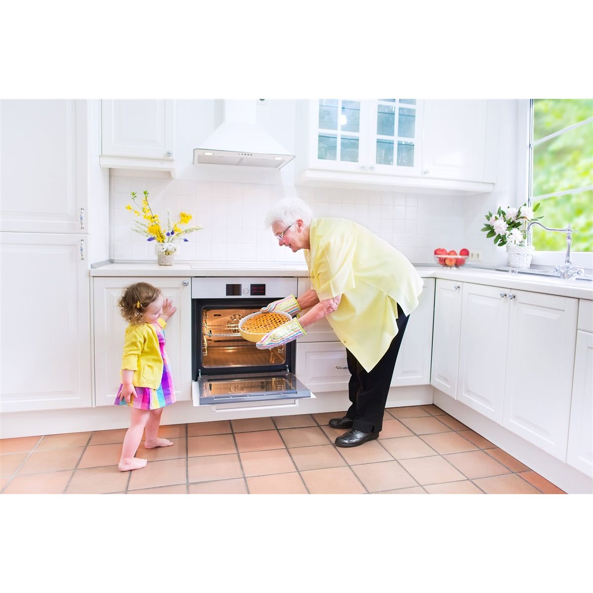 Great-grandma baking with her great-grandchild.